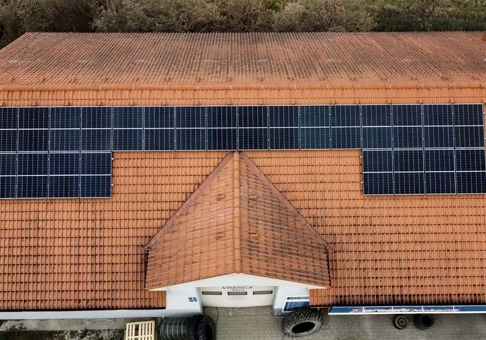 Panels on the orange tiled roof of a family home