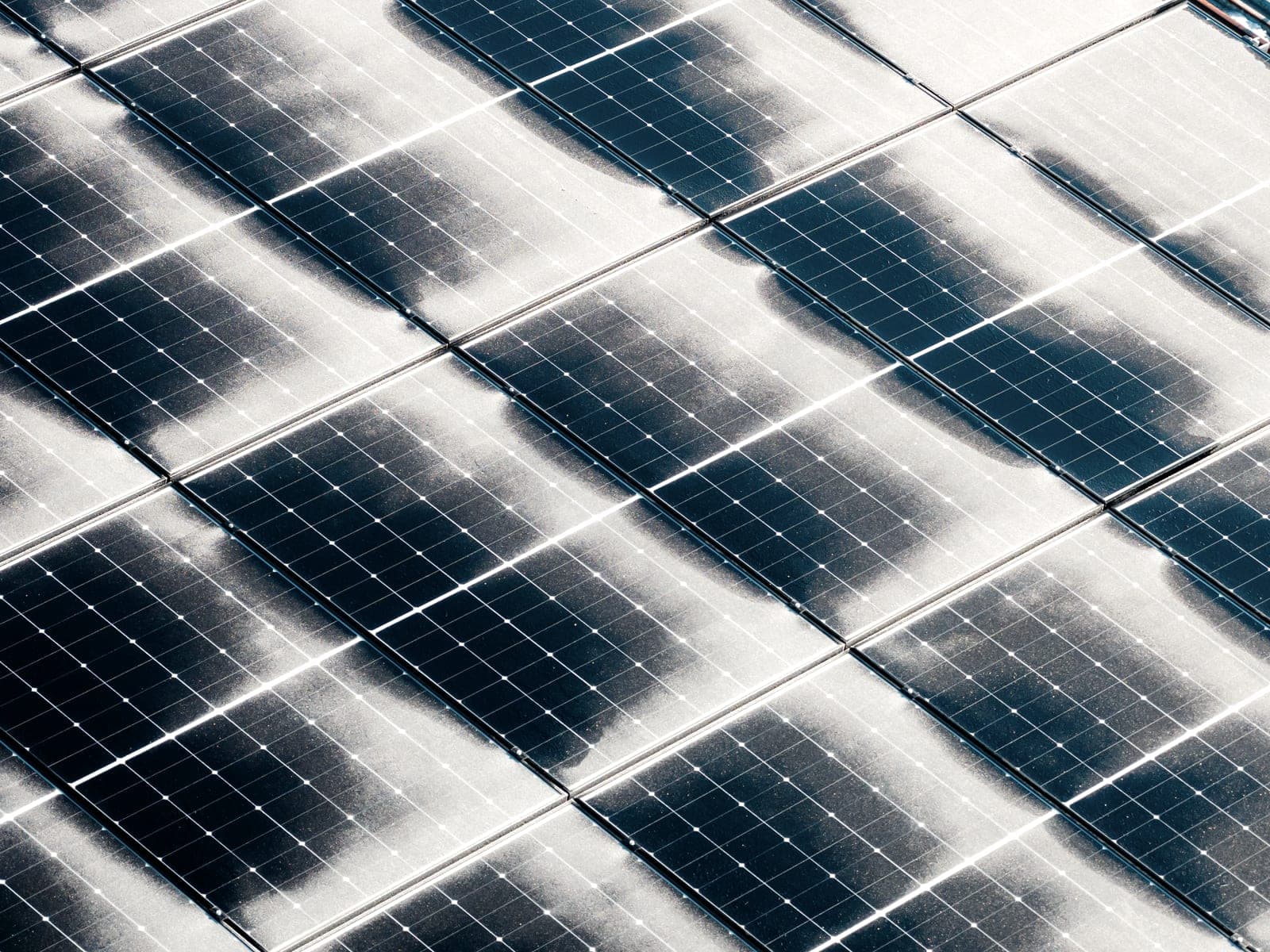 Close-up of solar panels with remnants of snow