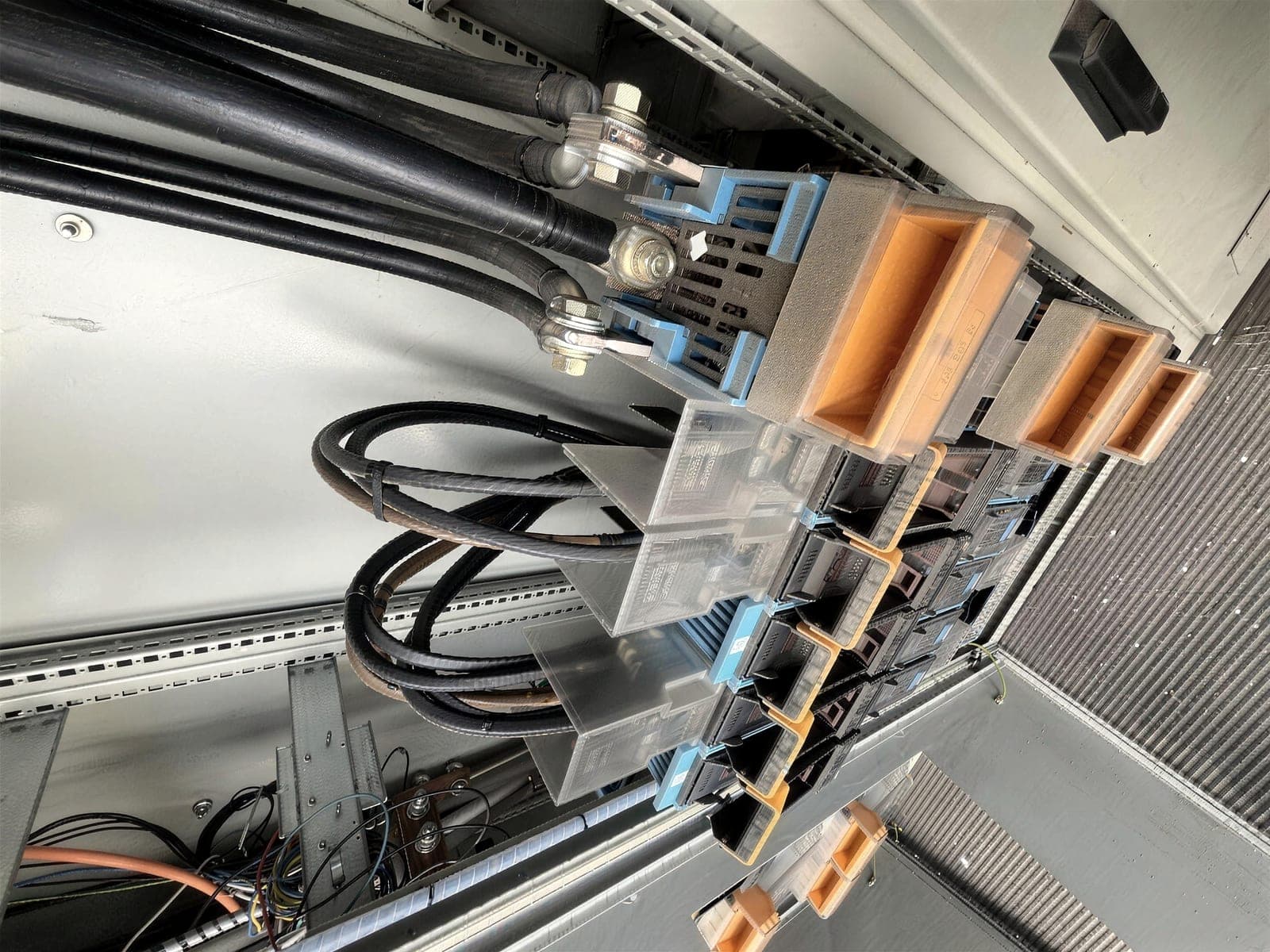 Close-up of copper busbars and cable lugs in a switchboard